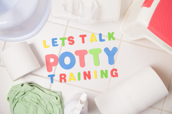 'Lets talk potty training' wording on bathroom floor