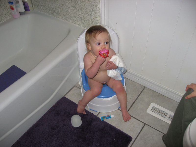 Toddler sitting on a potty
